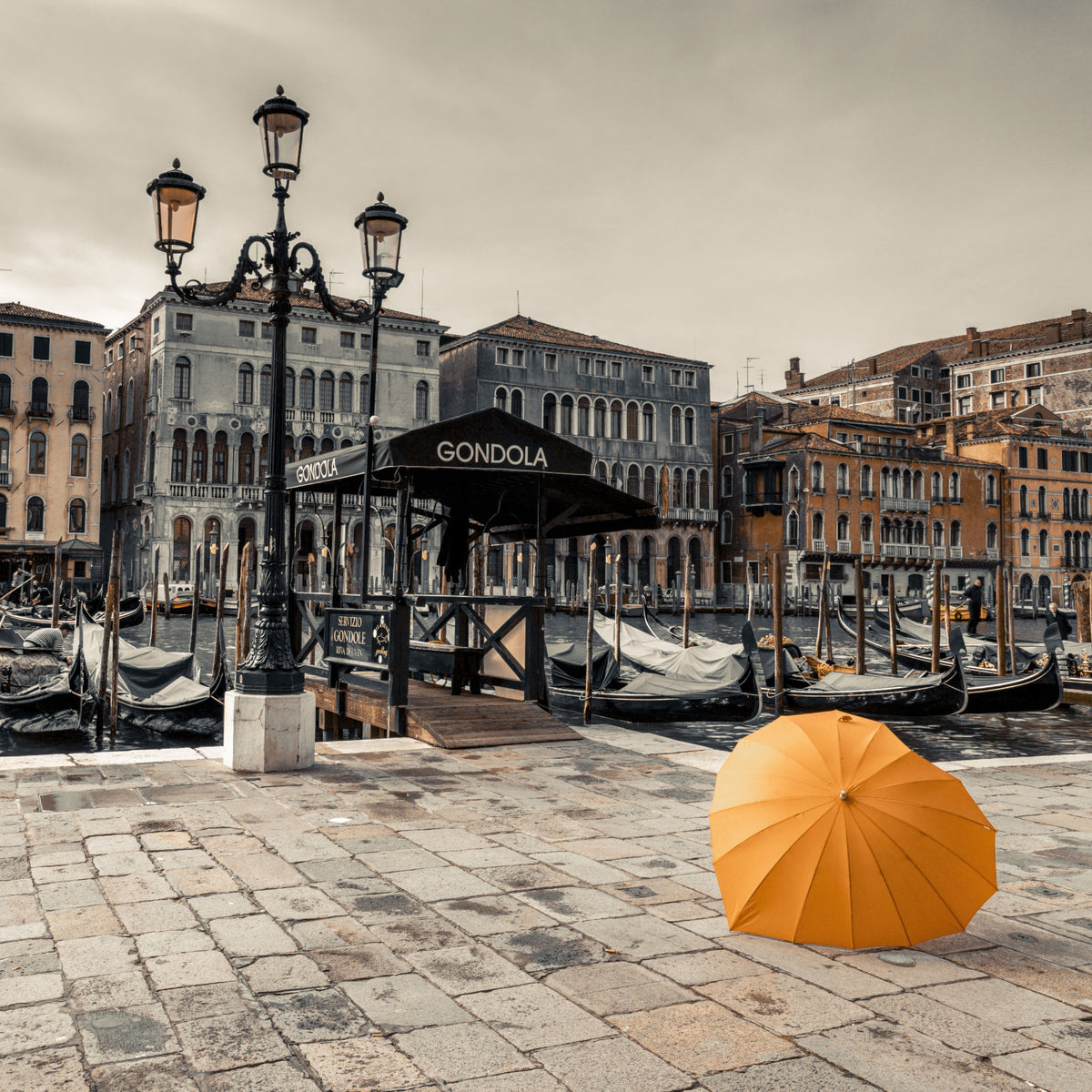 Serene Venice Canal with Orange Umbrella Wall Mural in your room