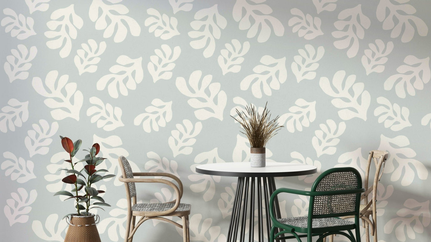 A photo-realistic wall mural with a repeating pattern of green leaves.

