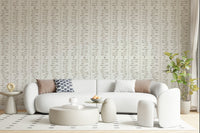 Bohemian aesthetic leaf branch wall mural cream hues.