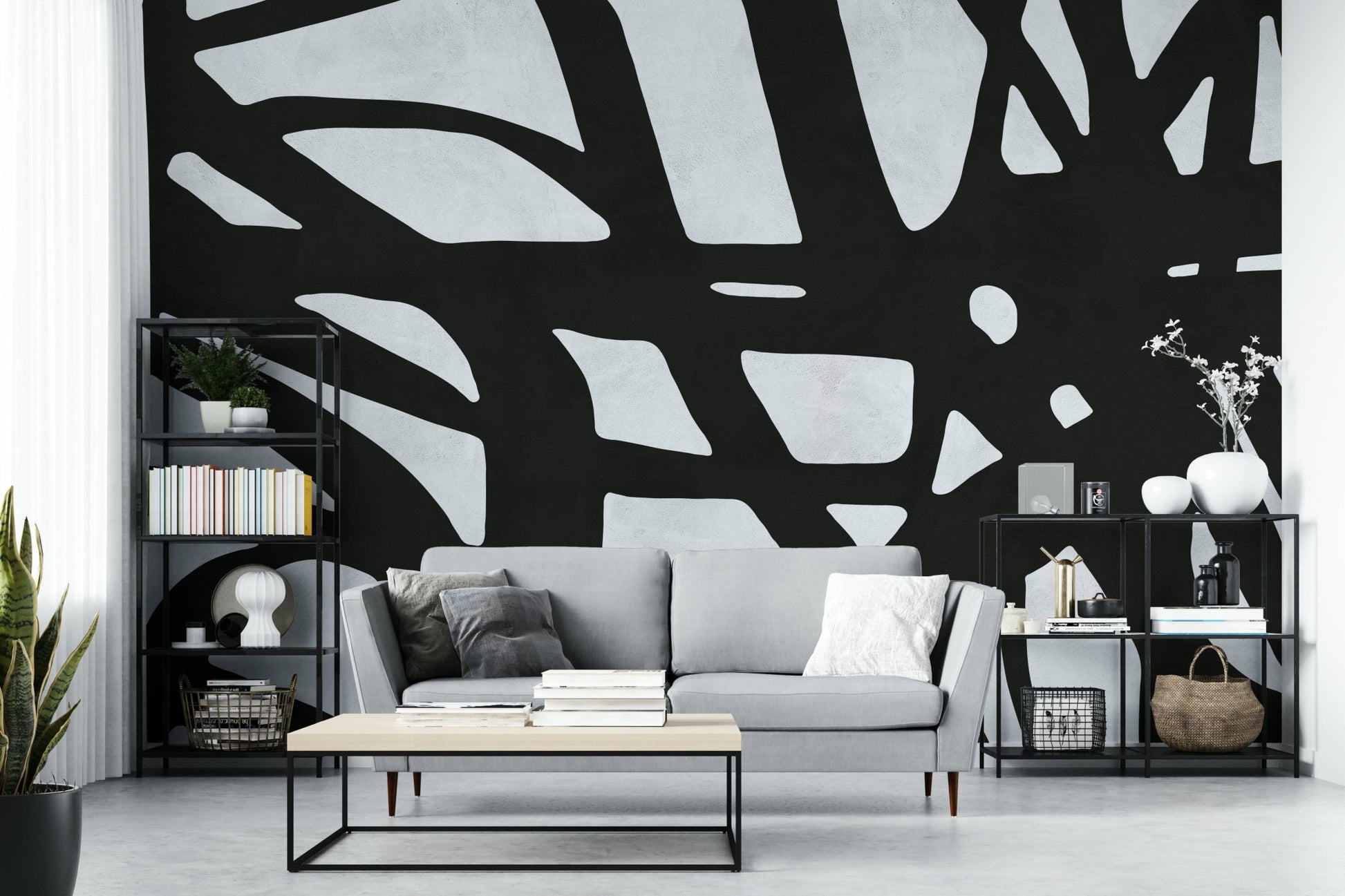 The room feels dramatic and chic due to the dark, elegant design.

