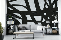 The room feels dramatic and chic due to the dark, elegant design.

