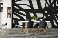 The colors are a dark, sophisticated palette of black and deep gray.

