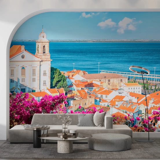 Lisbon View wallpaper mural of tiled rooftops and the Tagus river behind a grey sofa in an arched alcove