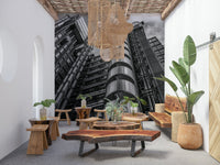 Bold industrial wallpaper, dramatic perspective highlights shining cylindrical facade sections.