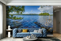 A wall mural of a loch and mountains.

