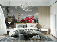 London Ride wallpaper mural in a modern bedroom with a brass chandelier and grey-and-white bedding