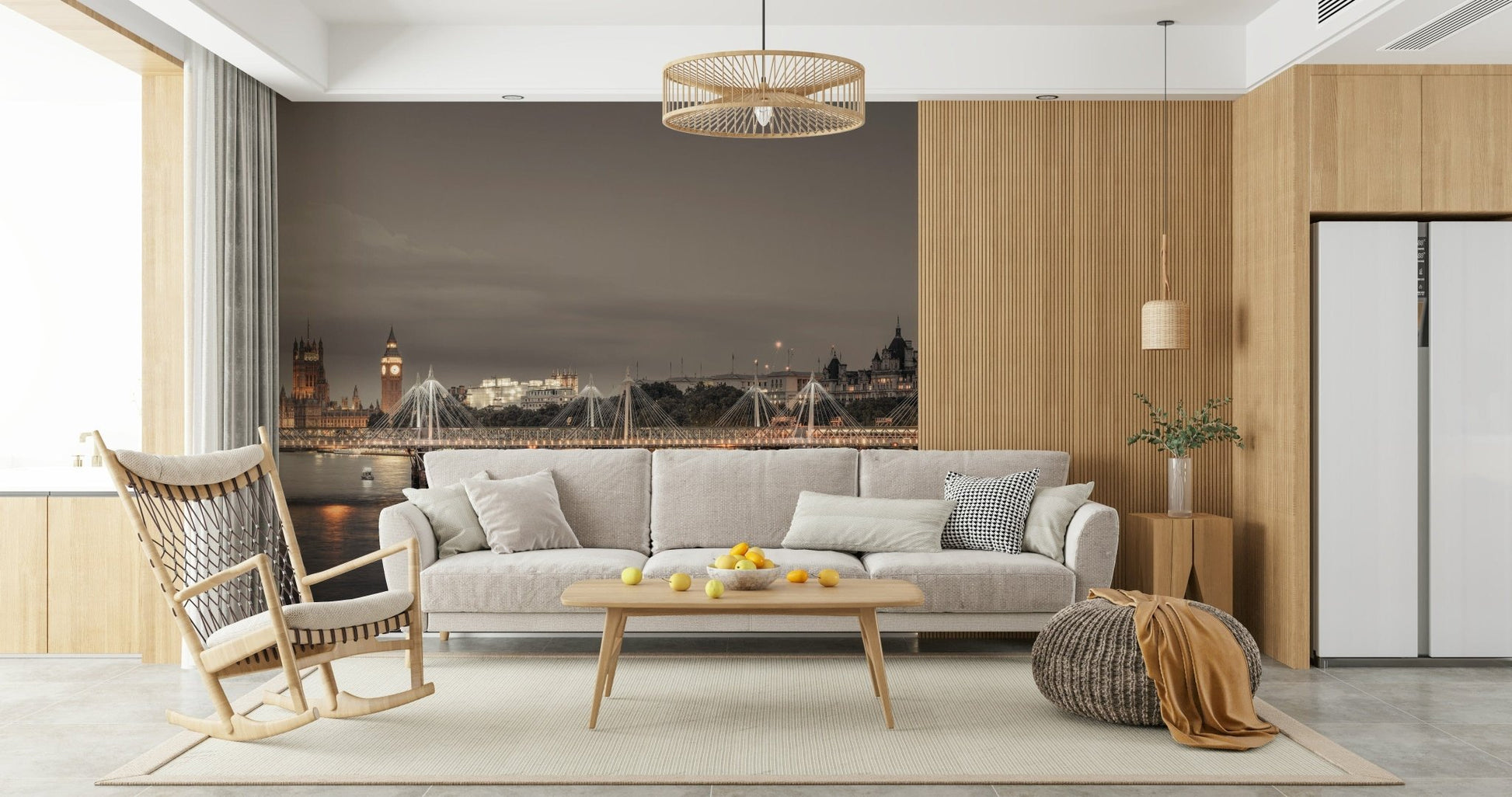 London's Nightfall wallpaper mural showing Big Ben at twilight behind a grey sofa and wood rocking chair in a living room