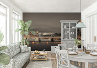 London's Nightfall wallpaper mural of the lit Thames bridge in an open-plan living and dining room with grey dresser