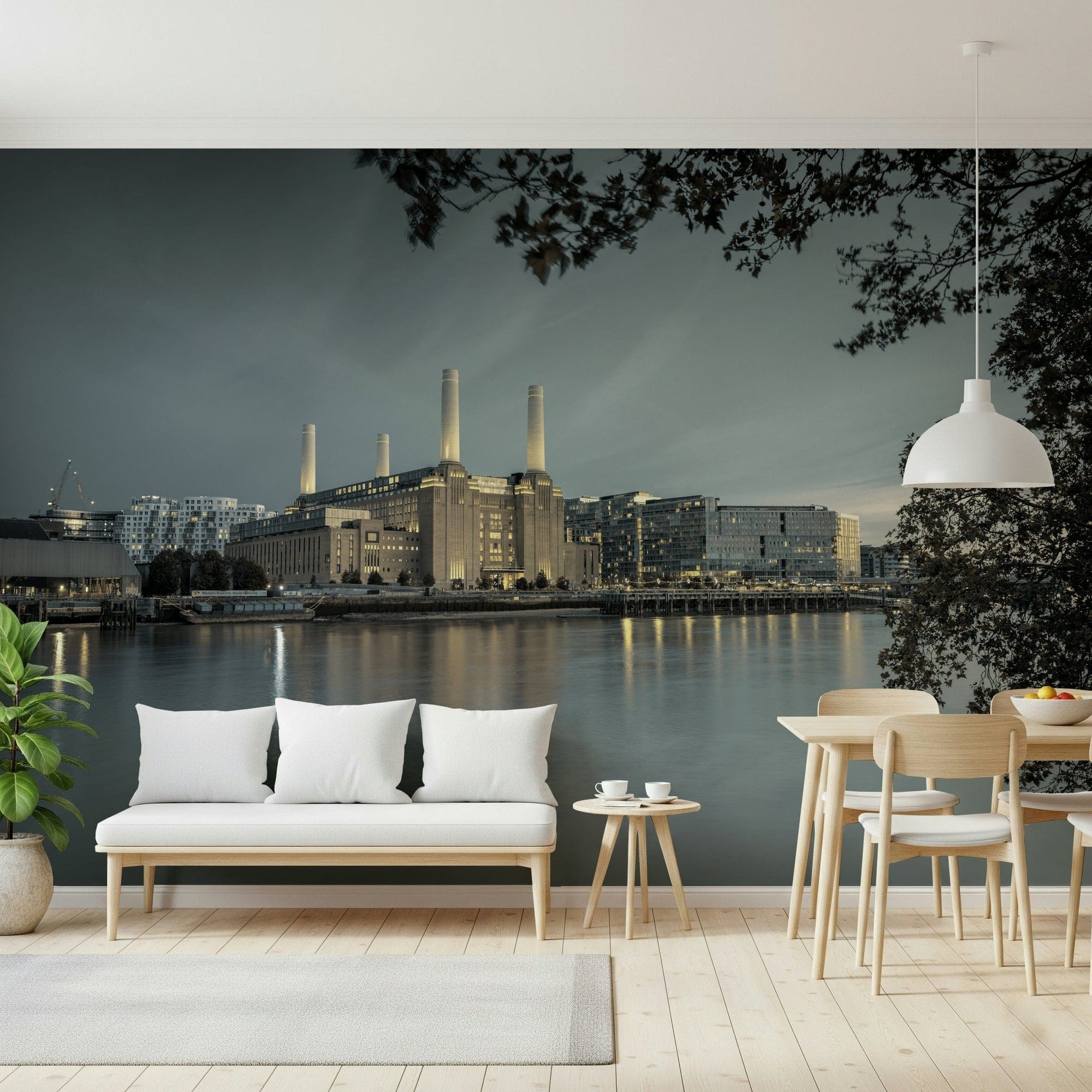 London's Powerhouse wallpaper mural of Battersea Power Station behind a white daybed and pale wood dining set