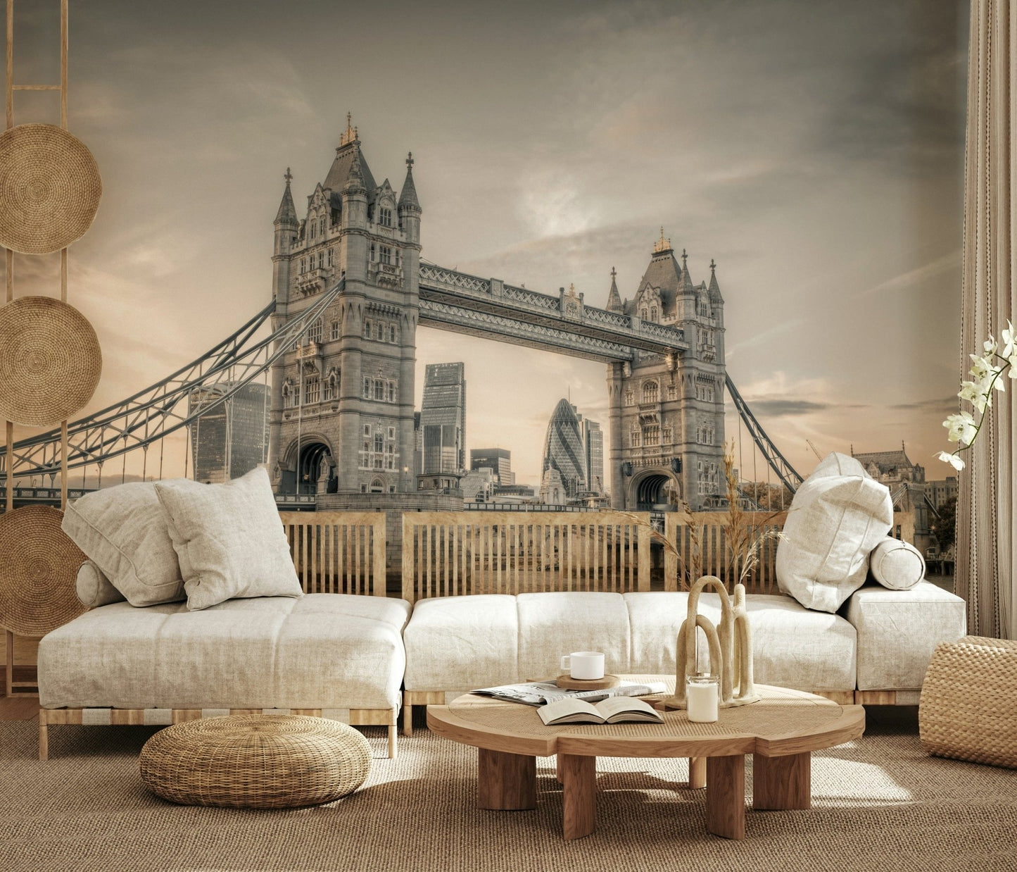London's Tower Bridge wallpaper mural in sepia behind a cream linen sofa with a woven pouf