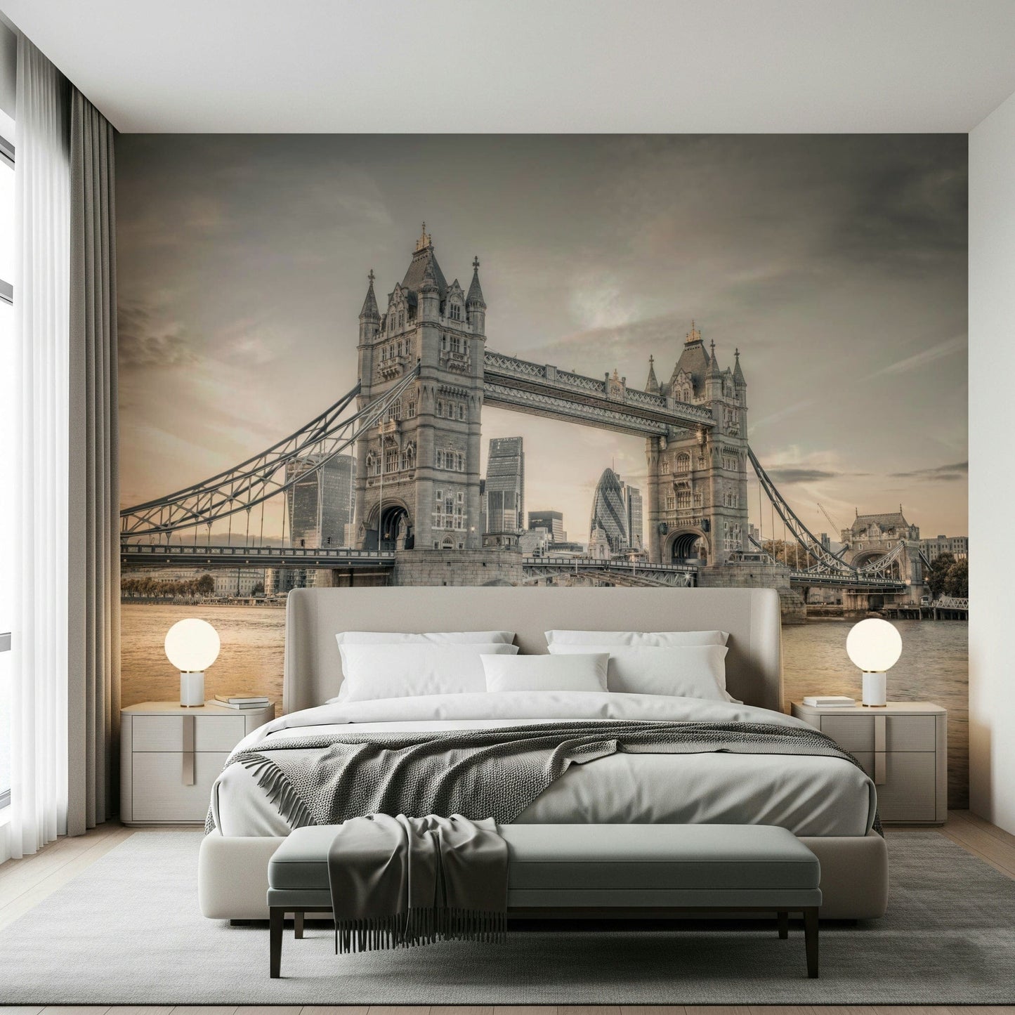 London's Tower Bridge wallpaper mural in sepia behind a beige bed with globe lamps in a bedroom