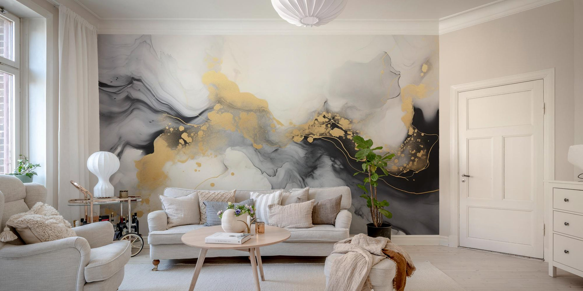 Luxurious Black and Gold Abstract Marble wallpaper mural in grey and gold behind a beige sofa and fiddle-leaf fig in a living room