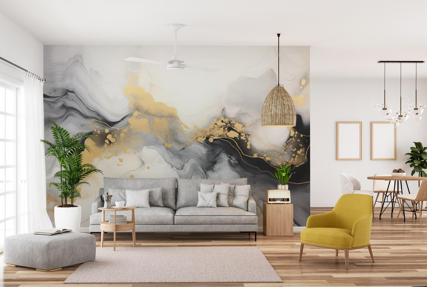 Luxurious Black and Gold Abstract Marble wallpaper mural with gold splatter behind a grey sofa and yellow armchair in a living room