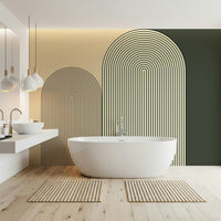 M-C Geo No 01 Minimalist Arch wallpaper mural in beige and green behind a freestanding tub in a modern bathroom
