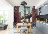 Empire State Building visible in the distance under the bridge.

