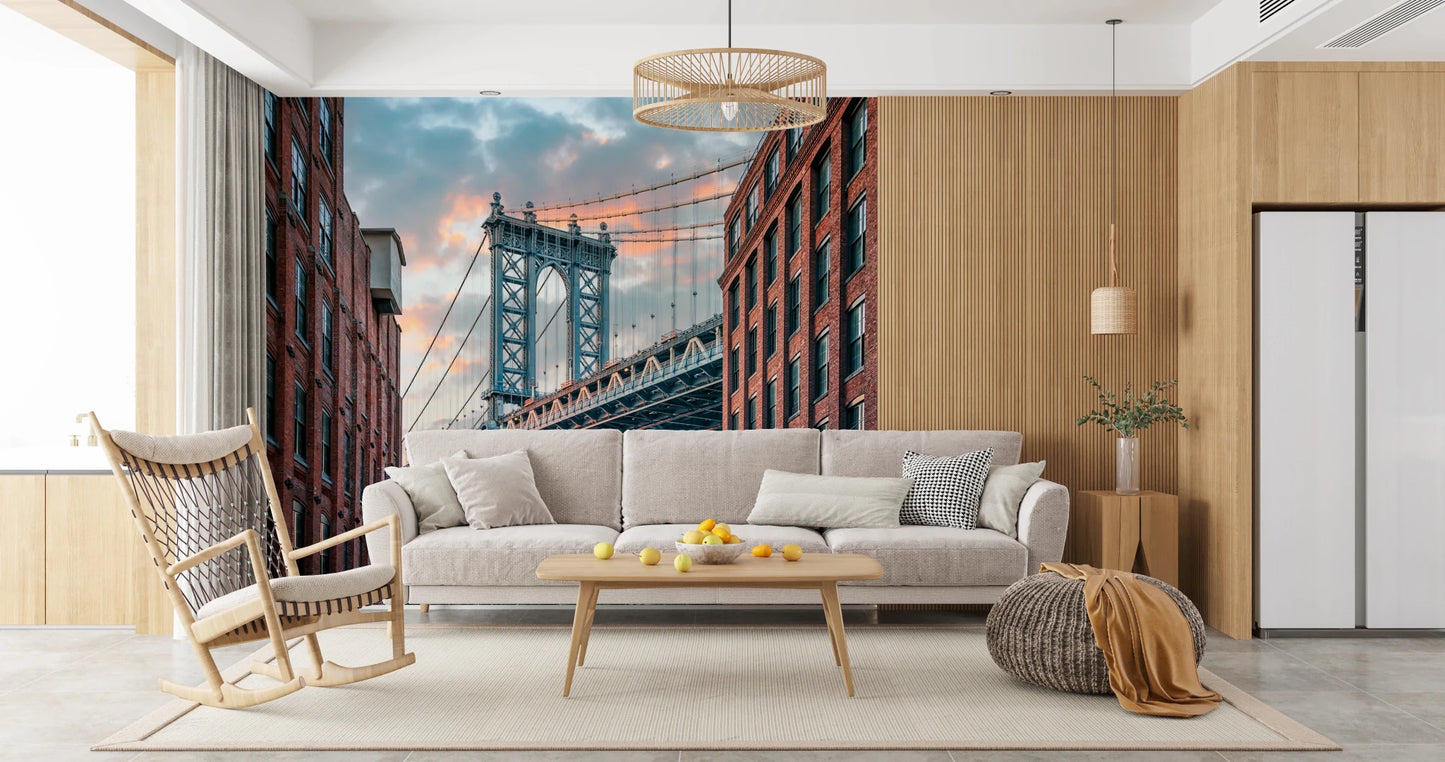 Manhattan Bridge Vista wallpaper mural of the bridge and brick lofts behind a cream sofa and wood rocking chair