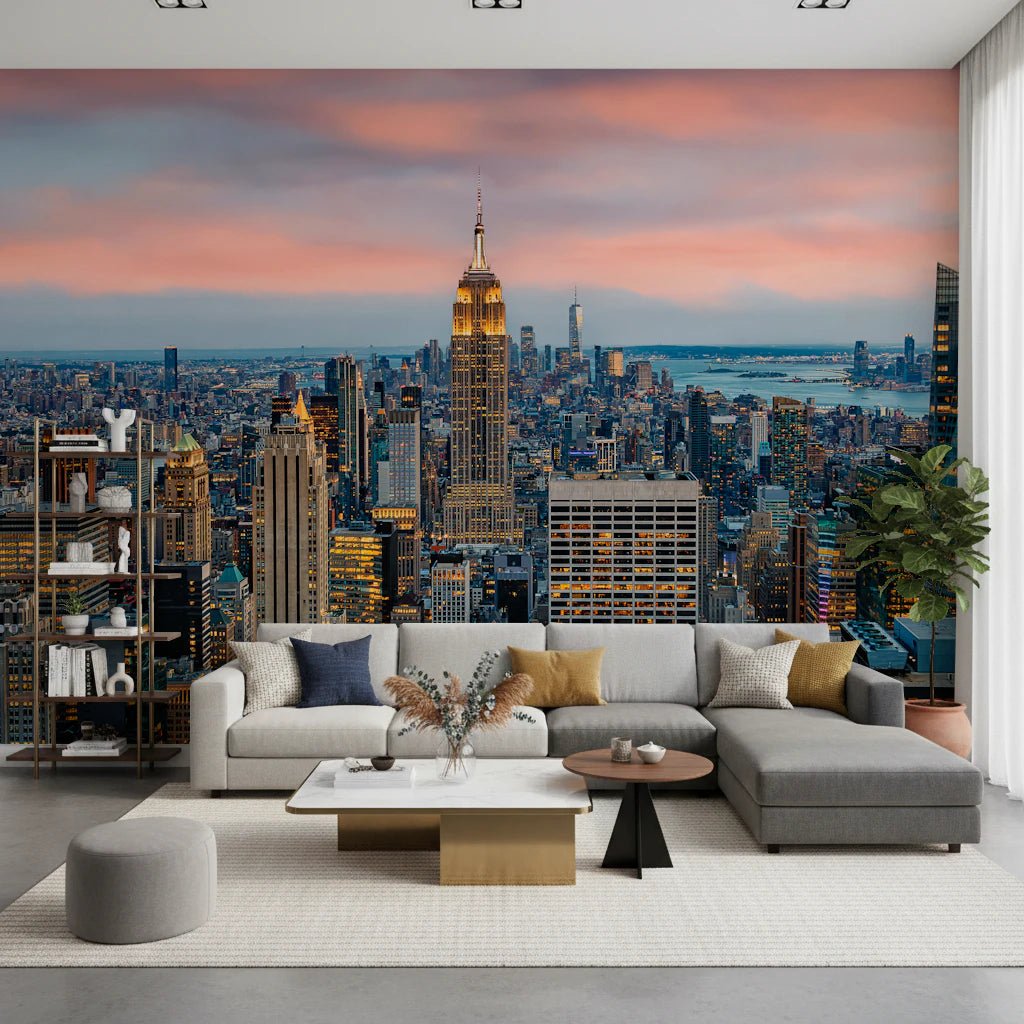 Manhattan Dawn wallpaper mural of the skyline at sunset behind a grey L-shaped sectional in a living room