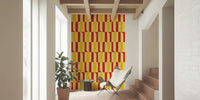 Marigold and Maple wallpaper in an entryway with a sheepskin sling chair and terracotta stairs