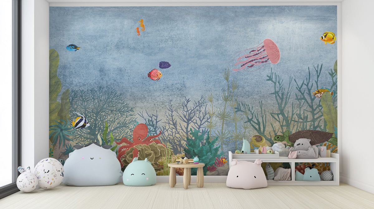 Marine Life Underwater wallpaper mural with jellyfish, octopus and tropical fish in a kids room with pastel plush poufs