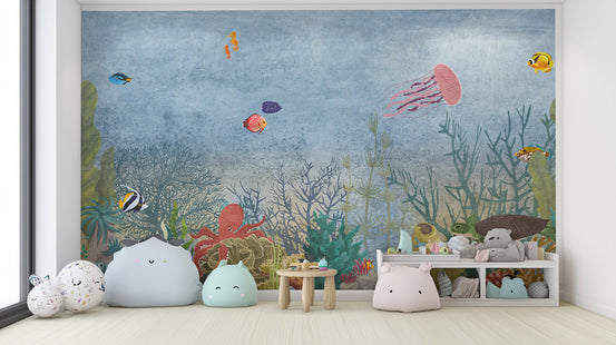 Marine Life Underwater wallpaper mural with jellyfish, octopus and tropical fish in a kids room with pastel plush poufs