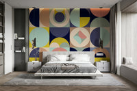 Mescolanza Alt V3 wallpaper mural in navy, peach and yellow circles behind a white platform bed and grey nightstands