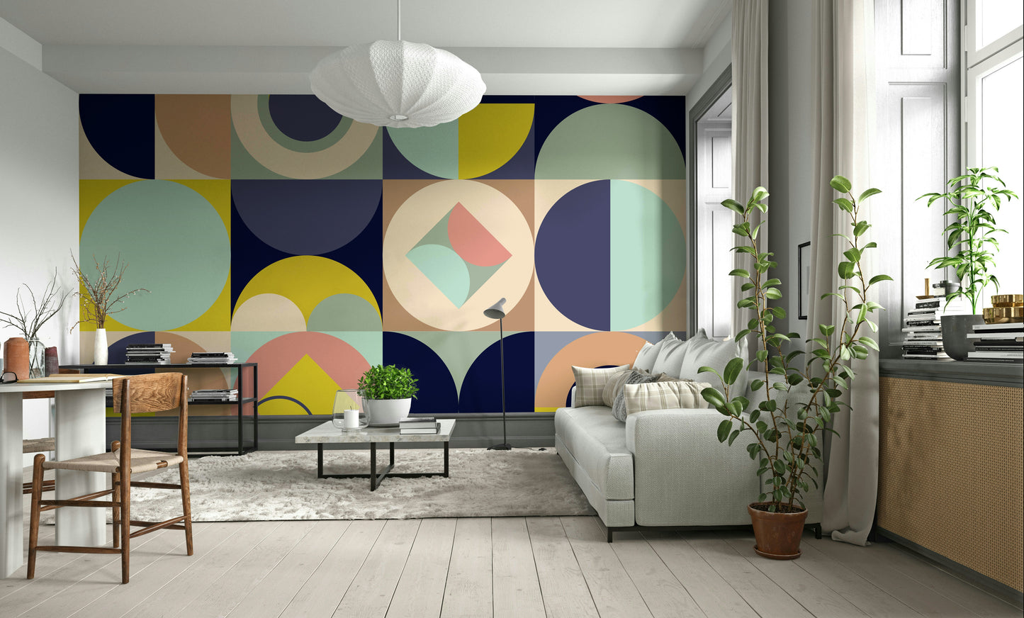 Mescolanza Alt V3 wallpaper mural in navy and mustard behind a pale grey sofa and wooden desk in a bright home office