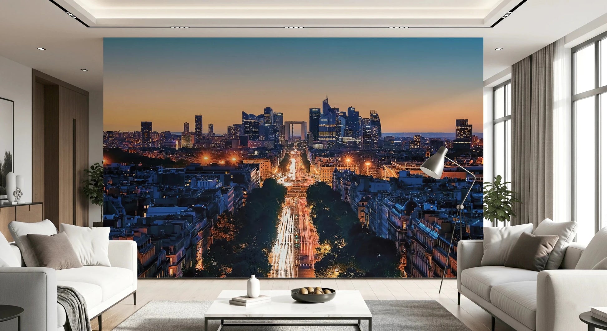 Metropolis Dusk wallpaper mural of a twilight skyline and avenue lights behind two cream sofas in a living room