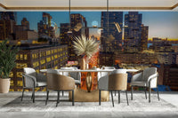 The image shows a sweeping panoramic view of a modern metropolis as the sun sets.

