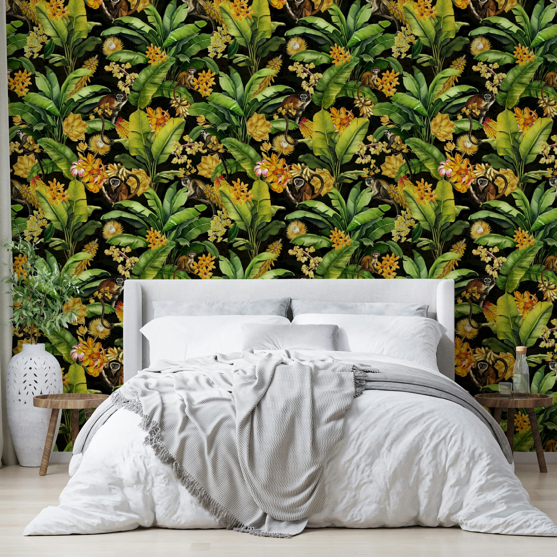 Fun, whimsical mural with monkeys in a jungle setting against dark tones.

