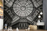 Vaulted arch wall mural in bedroom, modern furniture, stone-toned neutral colours.