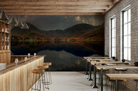 A close-up of the stars and galaxy over the mountains.

