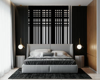 Minimal Black & White Stripes wall mural behind a grey upholstered bed framed by black slat walls in a bedroom