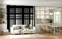 Minimal Black & White Stripes wall mural behind a white sofa beside a wood-grid partition in an open living room
