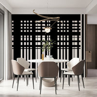 Minimal Black & White Stripes wall mural behind a round marble dining table and taupe chairs in a dining room