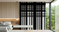 Minimal Black & White Stripes wall mural behind a low platform bed by a floor-to-ceiling garden window