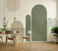 Minimalist Desert Vibes wallpaper mural in green and tan behind a wood dining table with pendant bulbs and fresh flowers