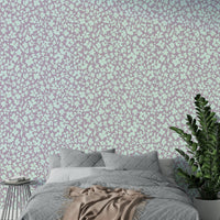 A full-wall mural showing a pattern of sketched flowers.
