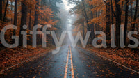 Misty autumn forest road wall mural with wet pavement and orange trees