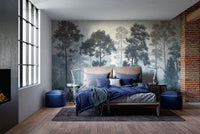 Misty Blue Forest wall mural behind a peach bed with blue bedding beside exposed brick in a bedroom