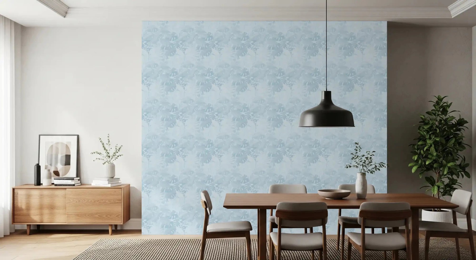 Misty BlueLeaf wallpaper in dining room with soft blue monstera leaves