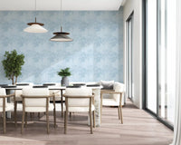 Blue monstera leaf wallpaper with layered botanical foliage