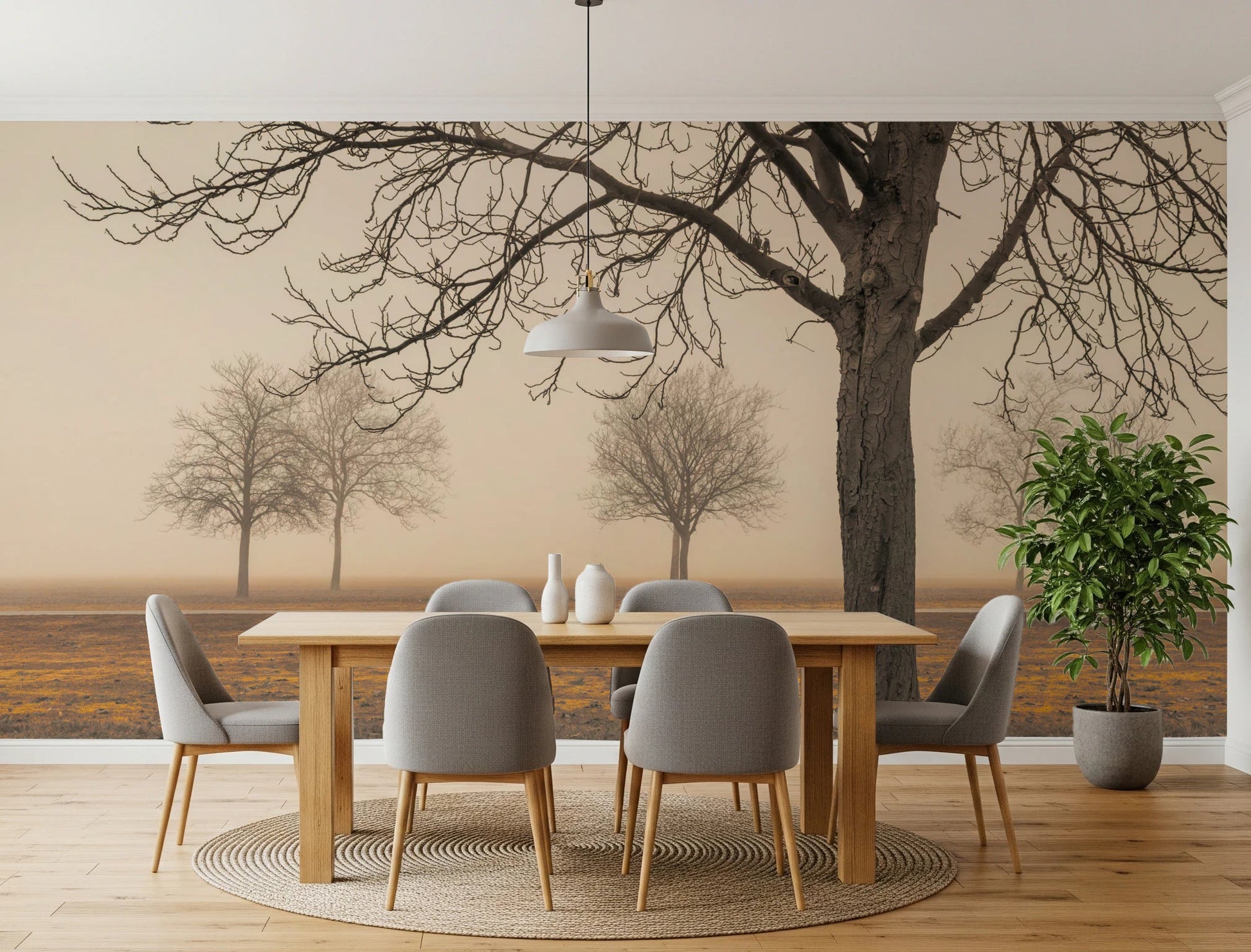 Misty Countryside wallpaper mural with sepia trees in fog behind an oak dining table and grey chairs in a dining room