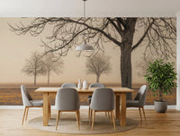 Misty Countryside wallpaper mural with sepia trees in fog behind an oak dining table and grey chairs in a dining room