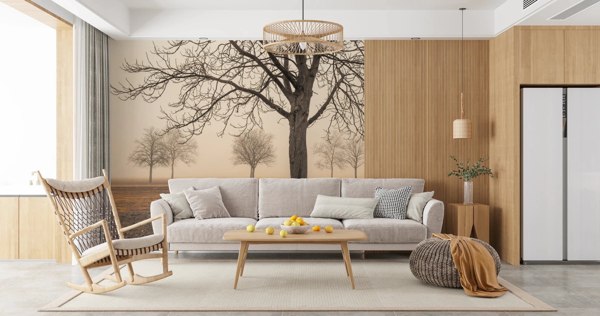 Misty Countryside wallpaper mural of foggy trees behind a grey sofa and wood rocking chair in a sunlit living room