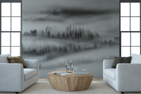 Forest trees shrouded in dense fog, captivating natural wallpaper design.