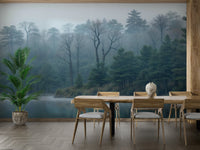 The image shows an artistic impression of a serene forest scene with a lake and mist.

