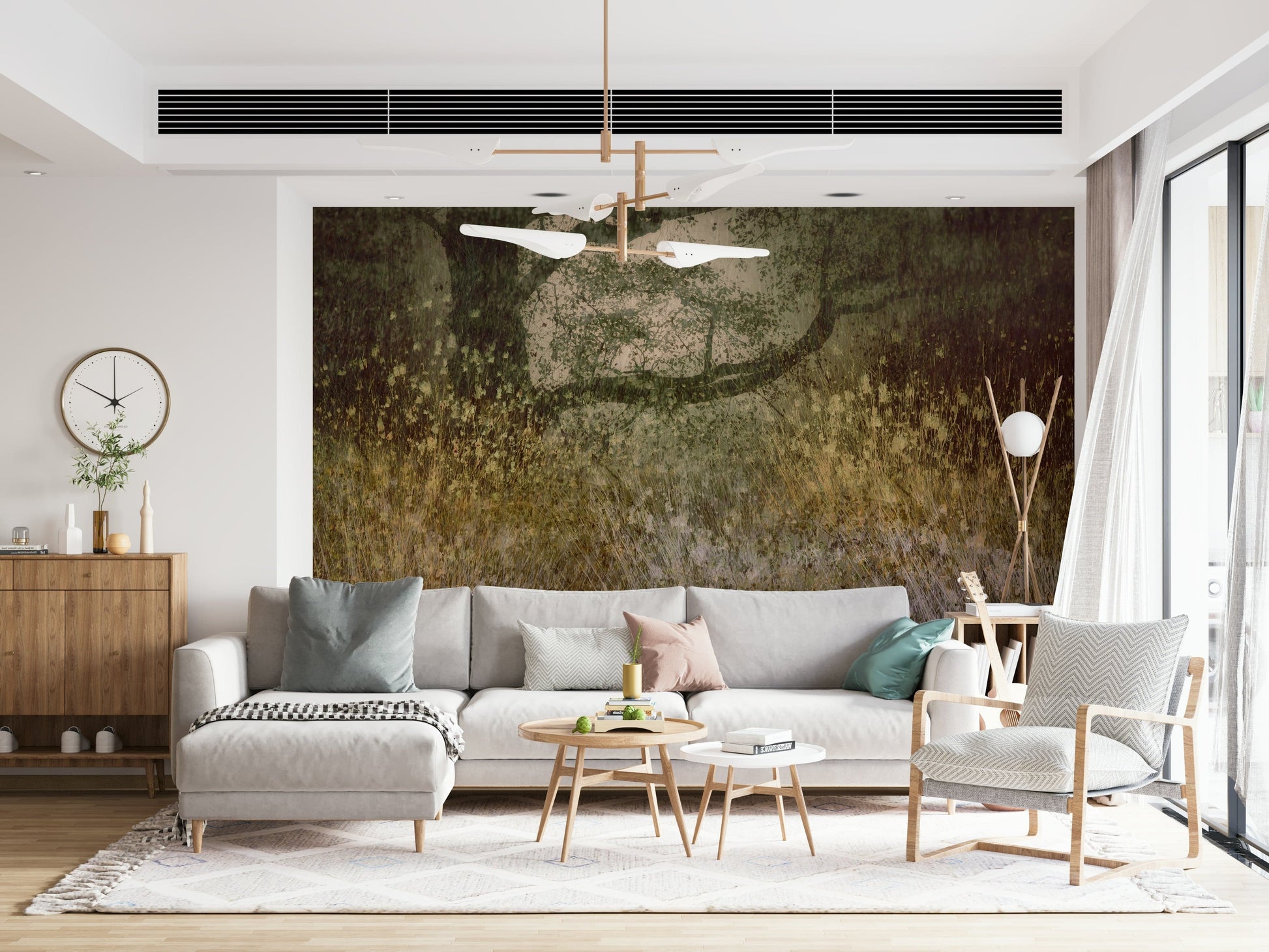 Filtered Light wallpaper mural of olive grassland behind a grey sectional sofa and wood sideboard