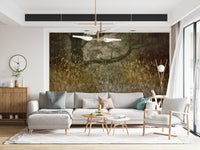 Filtered Light wallpaper mural of olive grassland behind a grey sectional sofa and wood sideboard