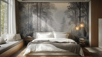 Misty Monochrome Forest wall mural in muted grey behind a bed with white bedding and globe pendant lights in a bedroom
