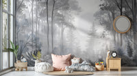 Misty Monochrome Forest wall mural in grey behind floor cushions and a pink pillow in a cosy kids room reading corner